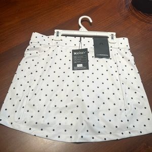 J. Lindeberg golf skort, size M, navy blue polka dots.